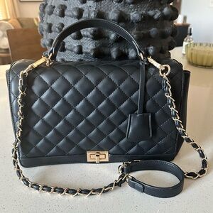 LTL London top handle quilted shoulder bag.